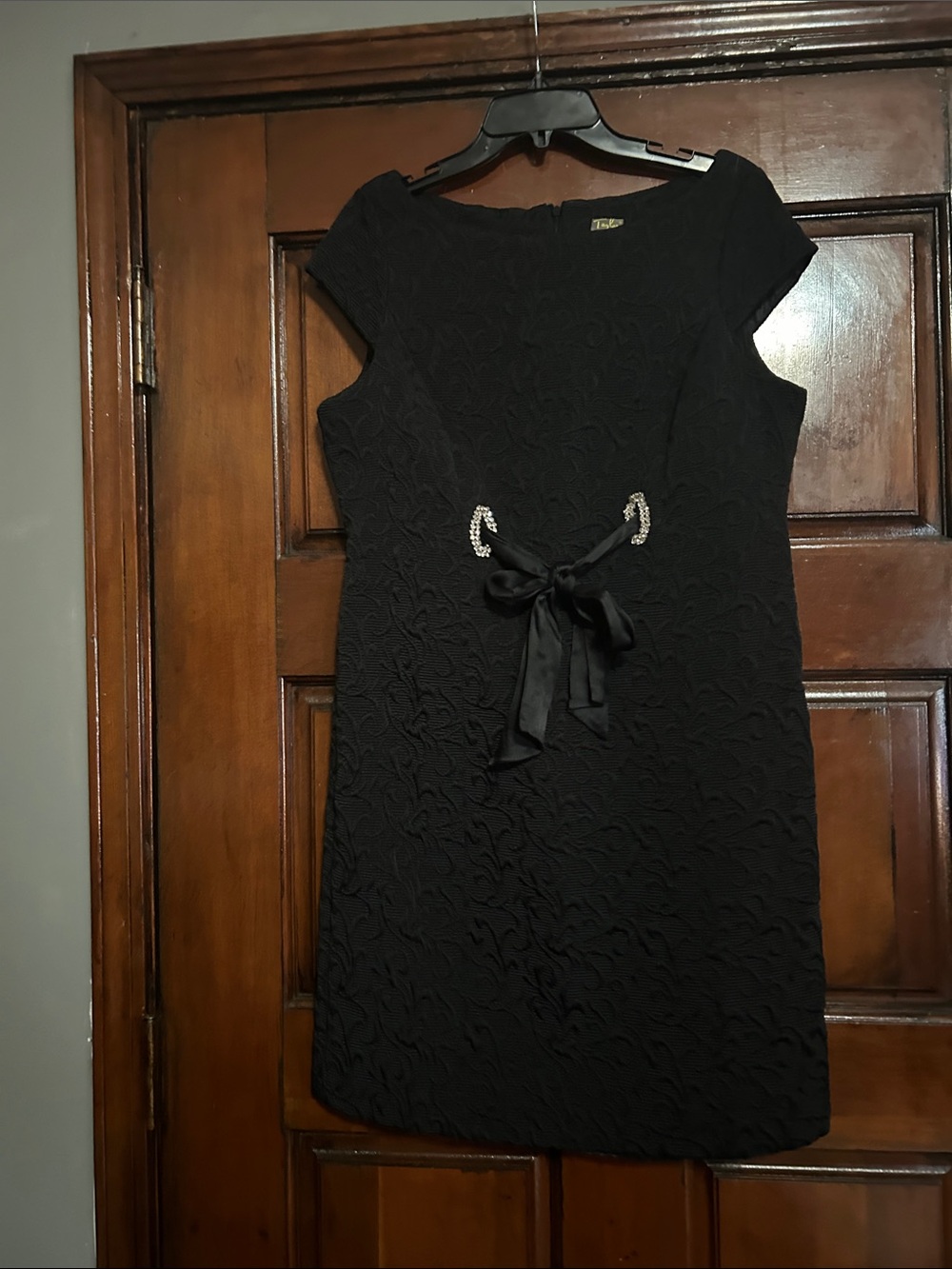 Taylor Black Embossed Mini Dress with Satin Bow and Rhinestone Accents
